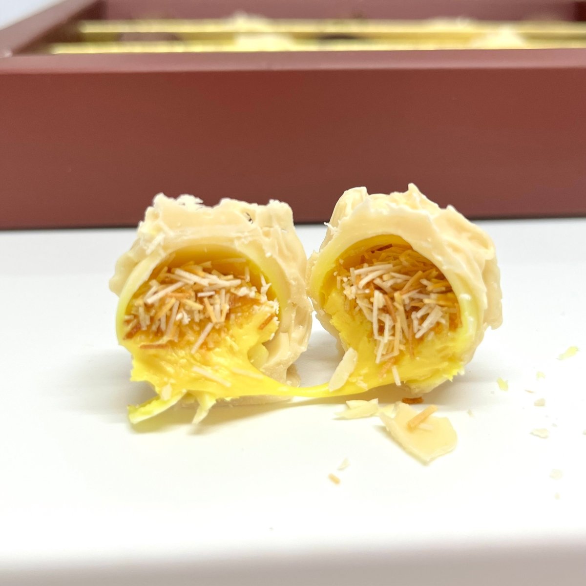 Ema Chocolate Milk and White Chocolate Truffles with Orange Cream Filled - Merry Christmas Box - 250g - TryAladdin